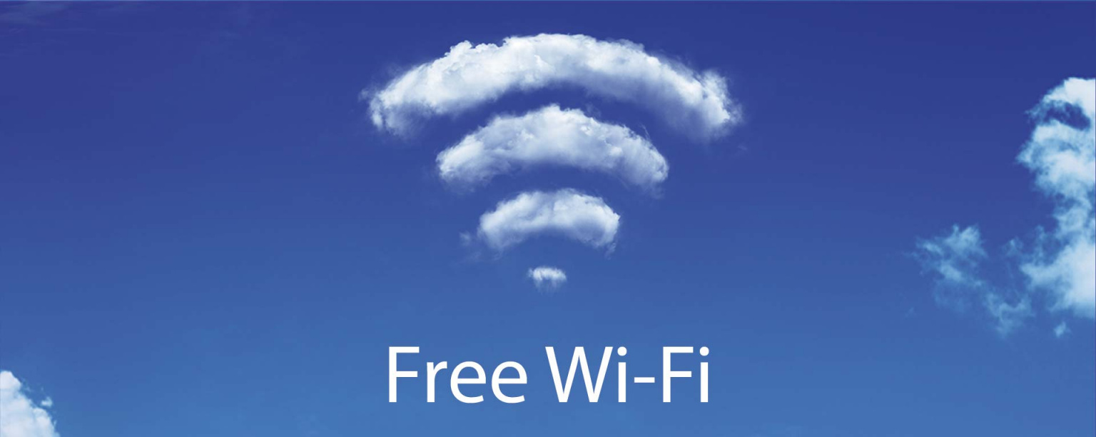 the words free wi-fi with wi-fi symbol of clouds on blue sky